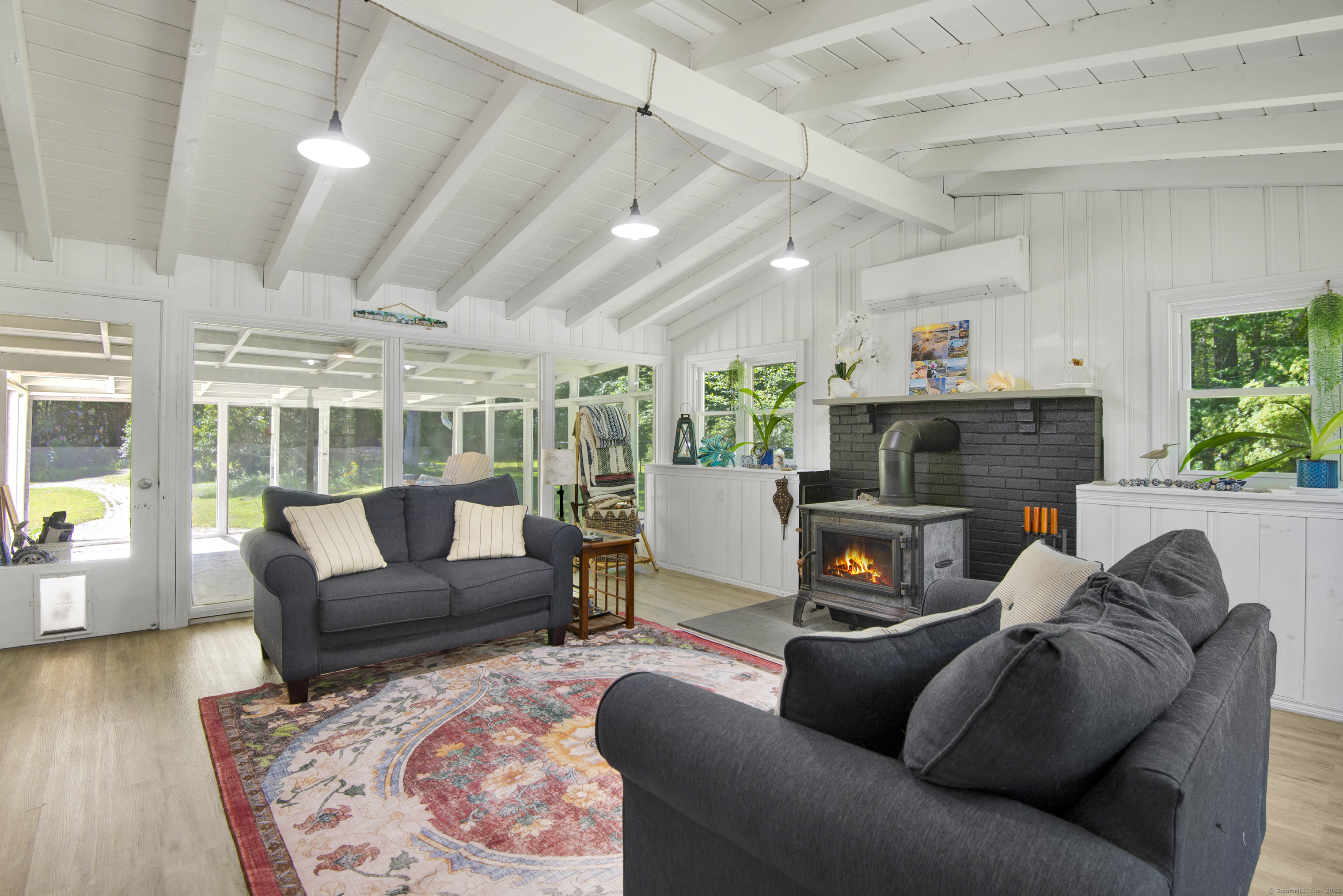 112 Cedar Swamp Road Deep River, CT 06417 - Photo 10 of 37 a living room with furniture and a fireplace