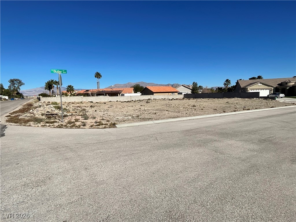 North Butler Street Las Vegas, NV 89149 - Photo 1 of 4 View of yard featuring a mountain view