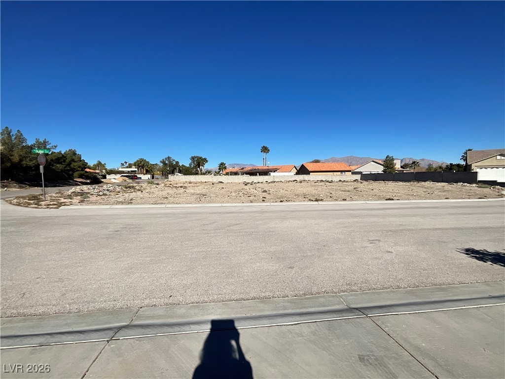 North Butler Street Las Vegas, NV 89149 - Photo 2 of 4 View of concrete road featuring traffic signs
