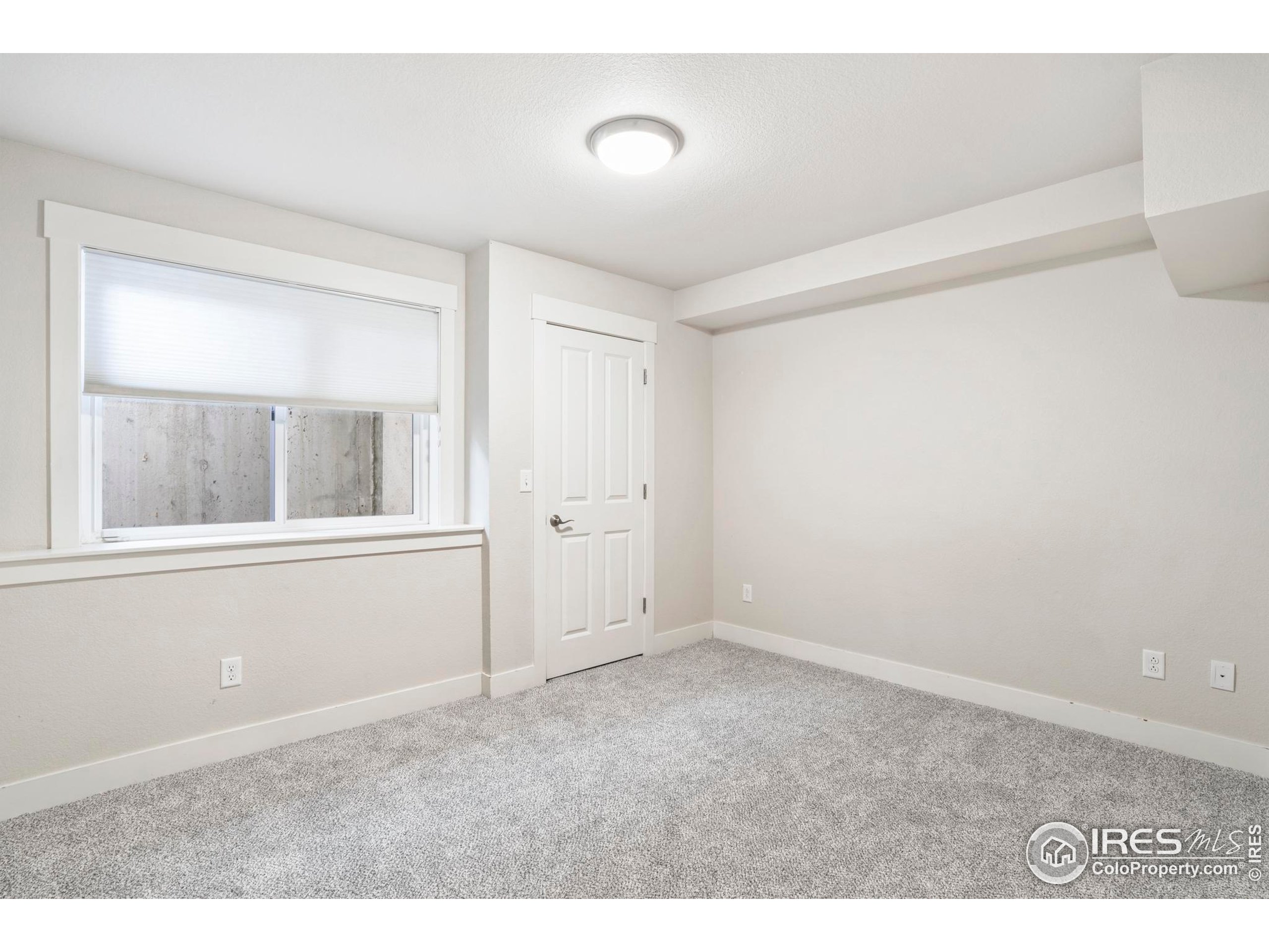 409 Terry Street, Unit B Longmont, CO 80501 - Photo 19 of 31 a view of an empty room with a window