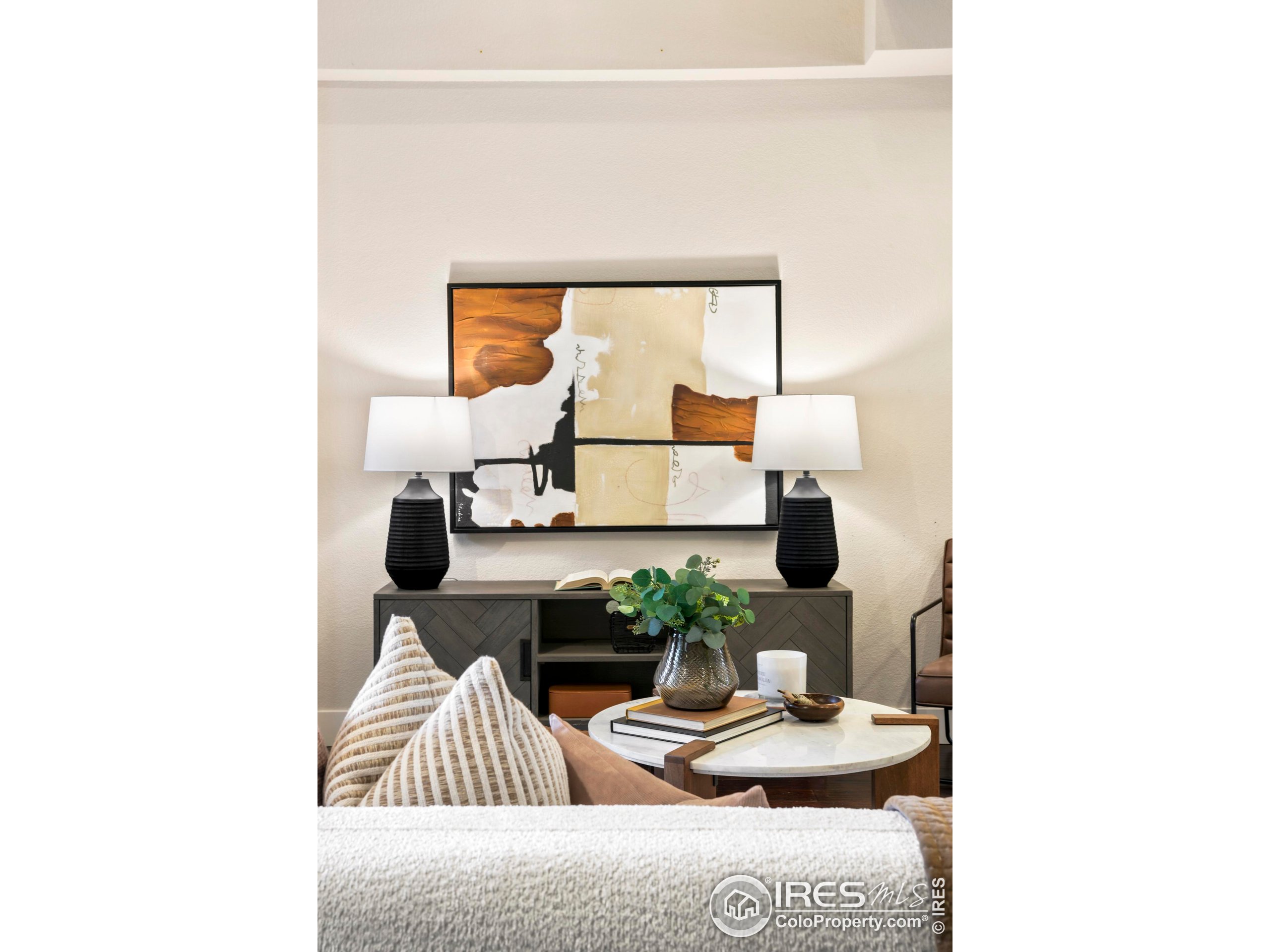 409 Terry Street, Unit B Longmont, CO 80501 - Photo 3 of 31 a living room with furniture and wooden floor