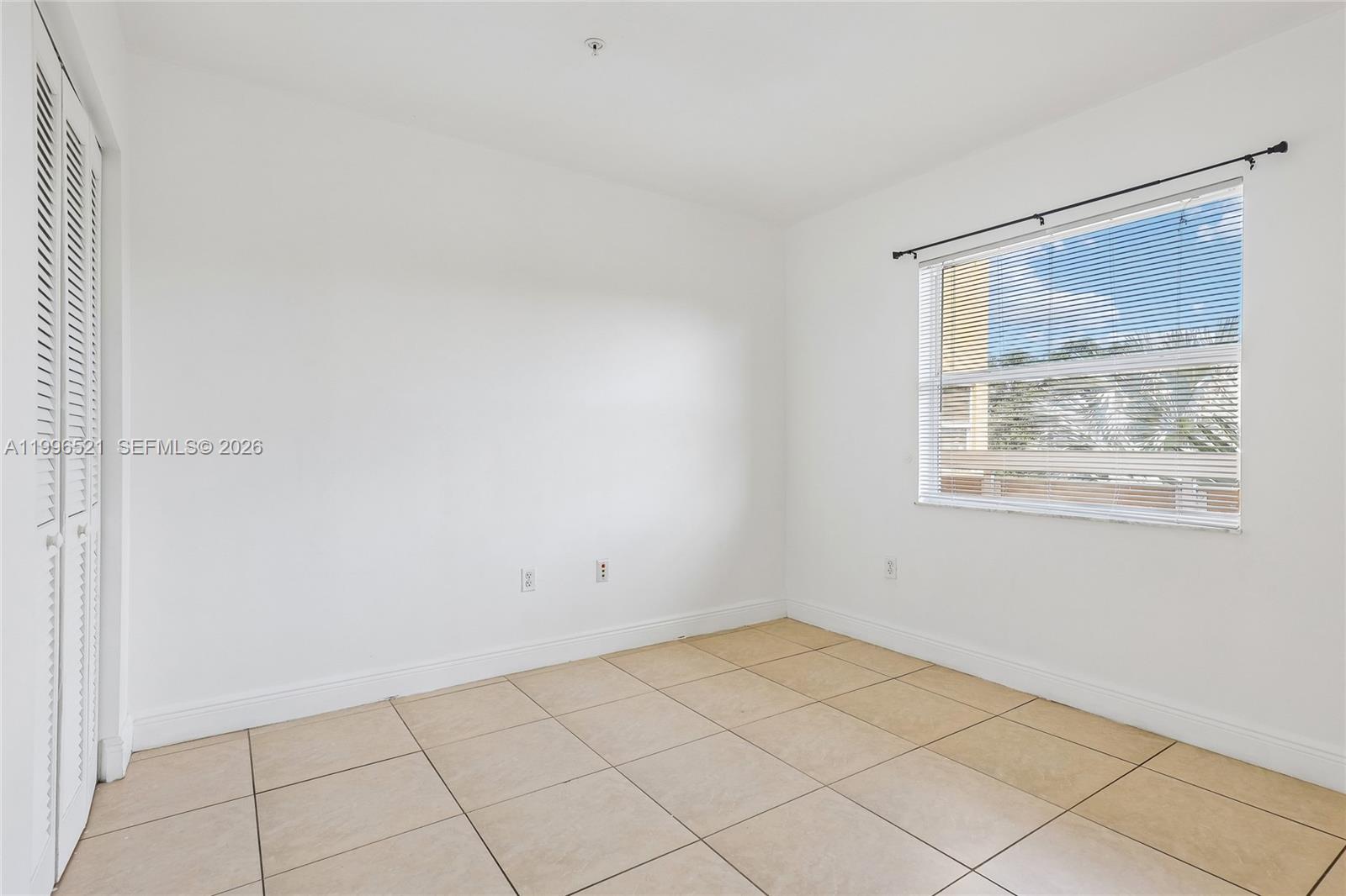 4137 Stirling Road, Unit 507 Dania Beach, FL 33314 - Photo 15 of 20 a view of an empty room with a window