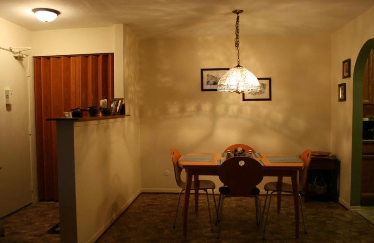 1075 Knoll Lane, Unit 302 Hoffman Estates, IL 60169 - Photo 5 of 11 a view of a room with a table and chairs