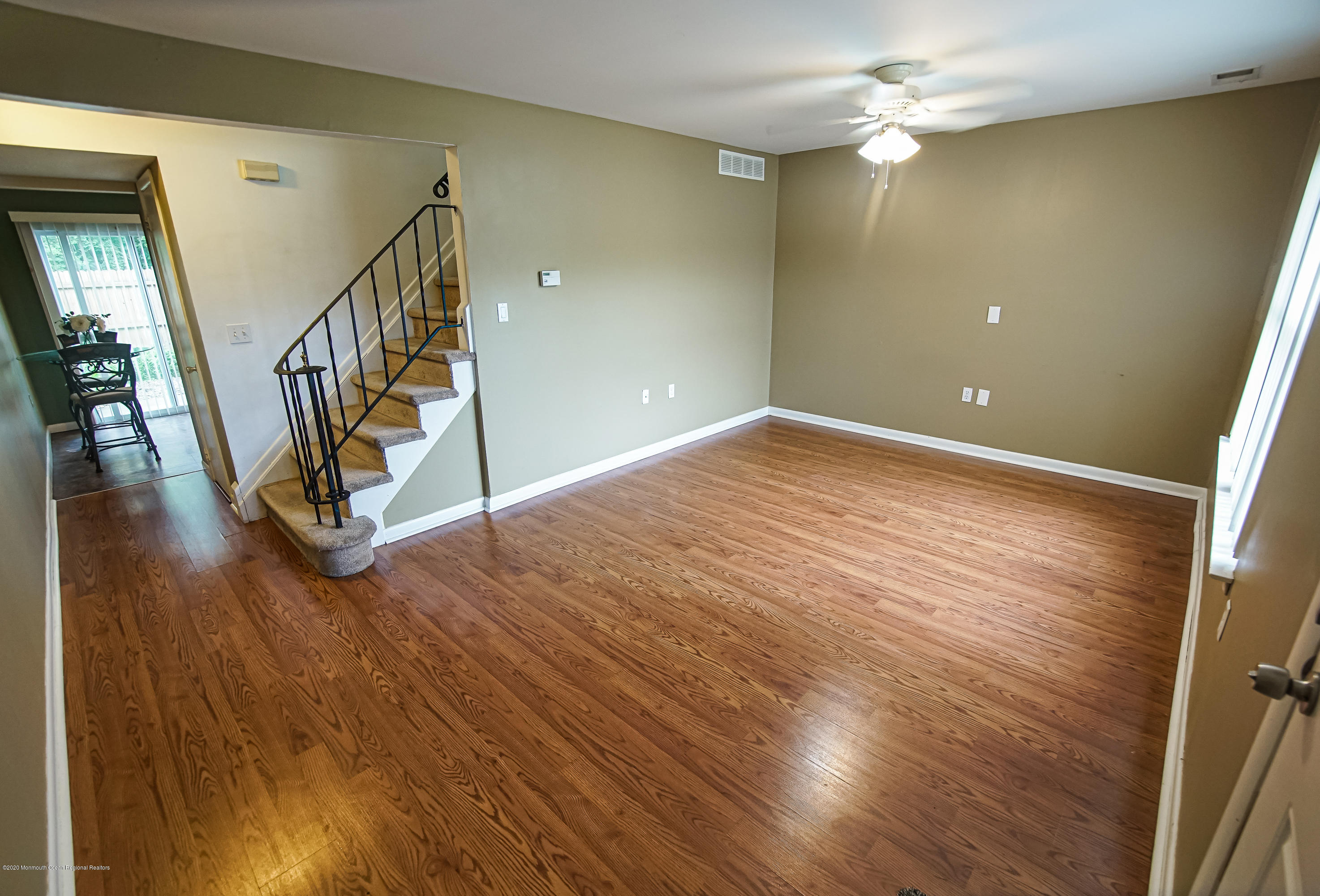 324 Greenwood Loop Road Brick, NJ 08724 - Photo 4 of 21 wooden floor in an empty room with a window