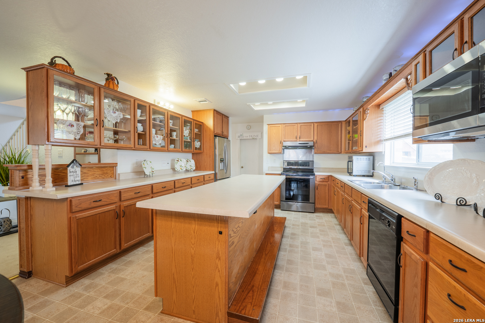 124 Springtree Grove Cibolo, TX 78108 - Photo 12 of 52 a kitchen with stainless steel appliances granite countertop a sink and cabinets