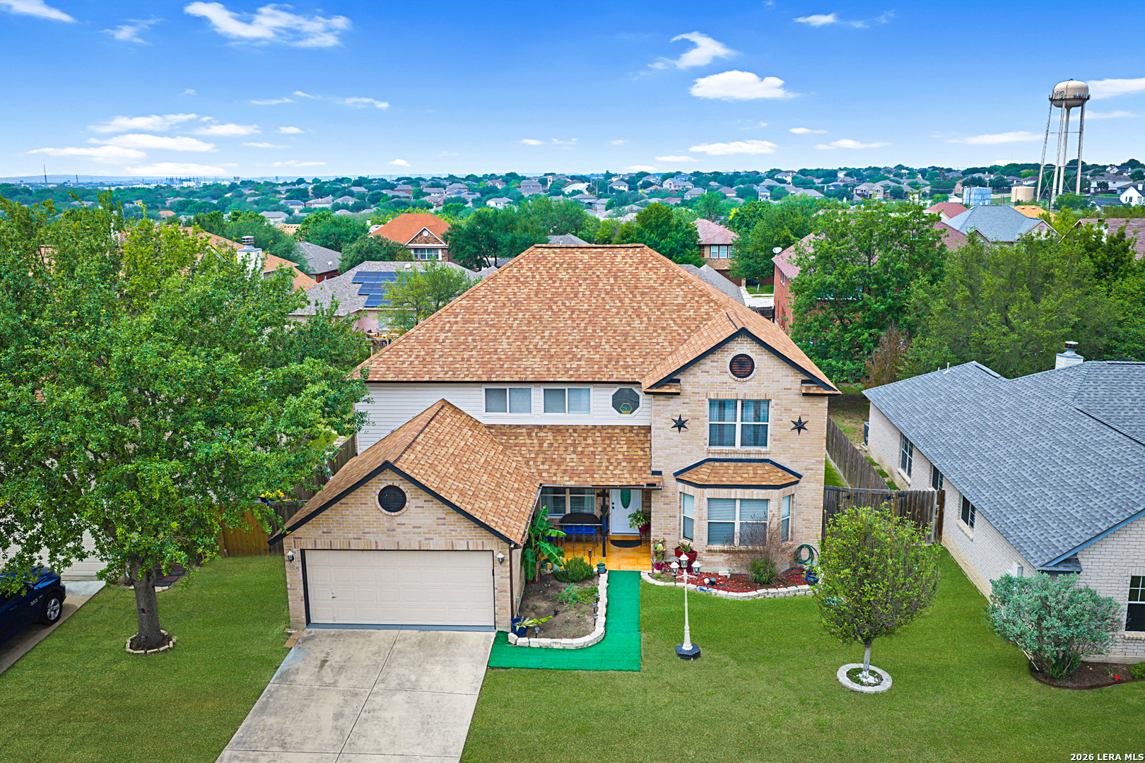 124 Springtree Grove Cibolo, TX 78108 - Photo 2 of 52 a front view of house with yard and green space