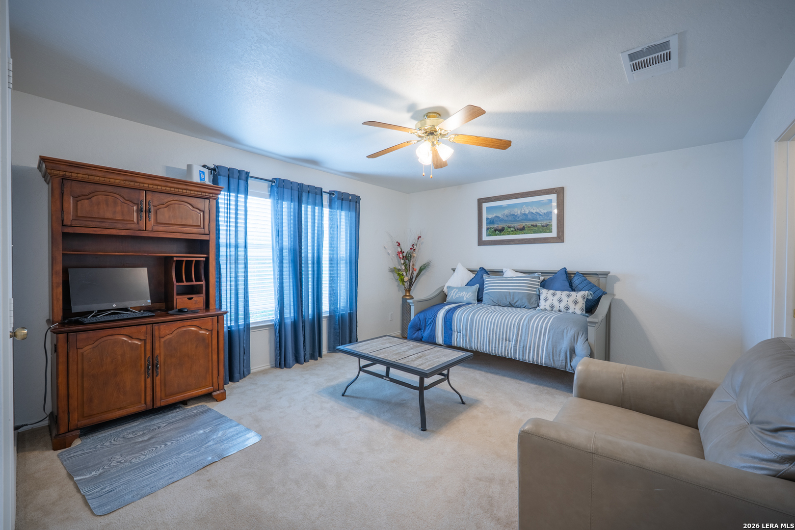 124 Springtree Grove Cibolo, TX 78108 - Photo 24 of 52 a living room with furniture and a flat screen tv