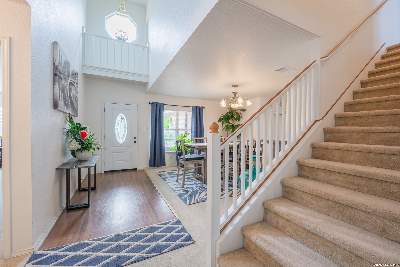 124 Springtree Grove Cibolo, TX 78108 - Photo 3 of 52 a view of entryway with wooden floor and stairs