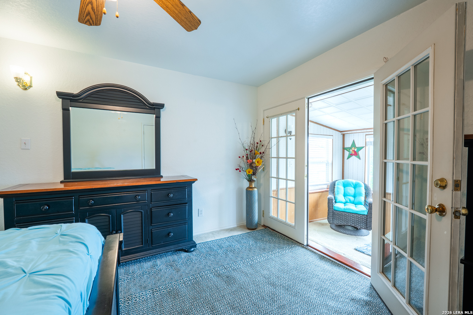 124 Springtree Grove Cibolo, TX 78108 - Photo 32 of 52 a living room with a bed furniture and a window