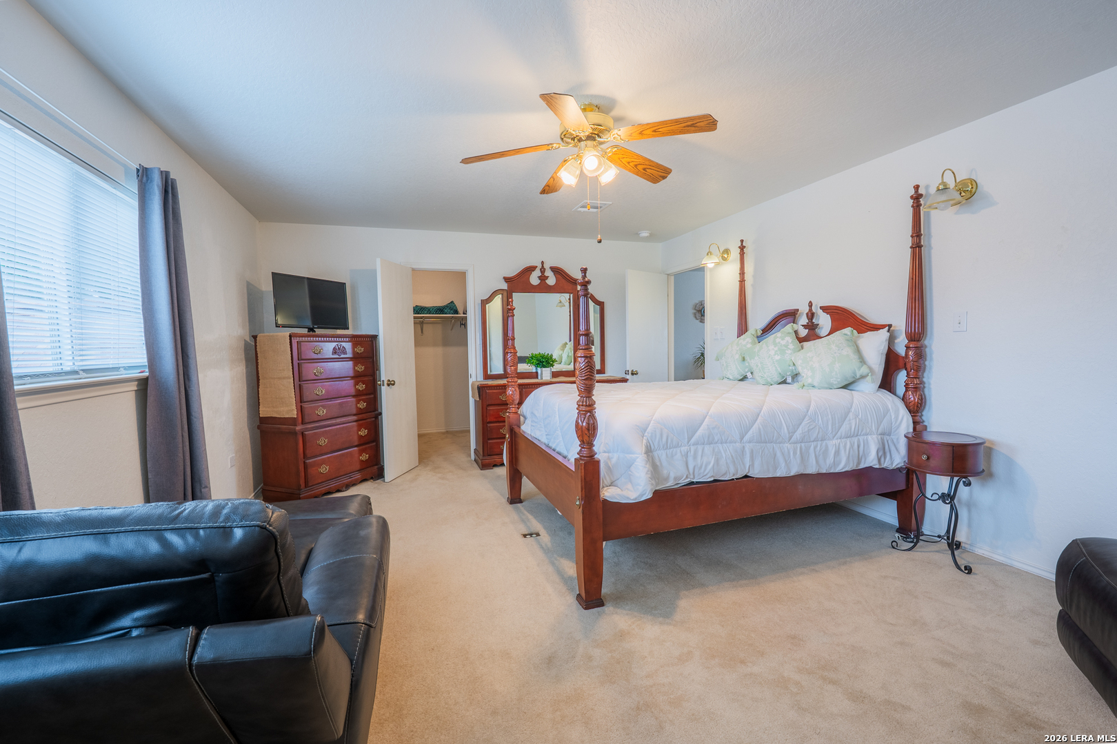 124 Springtree Grove Cibolo, TX 78108 - Photo 37 of 52 a bedroom with a bed and furniture