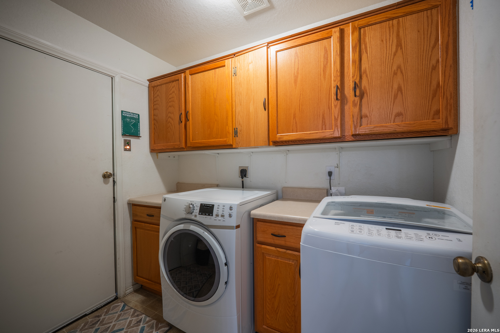 124 Springtree Grove Cibolo, TX 78108 - Photo 41 of 52 a utility room with dryer and washer