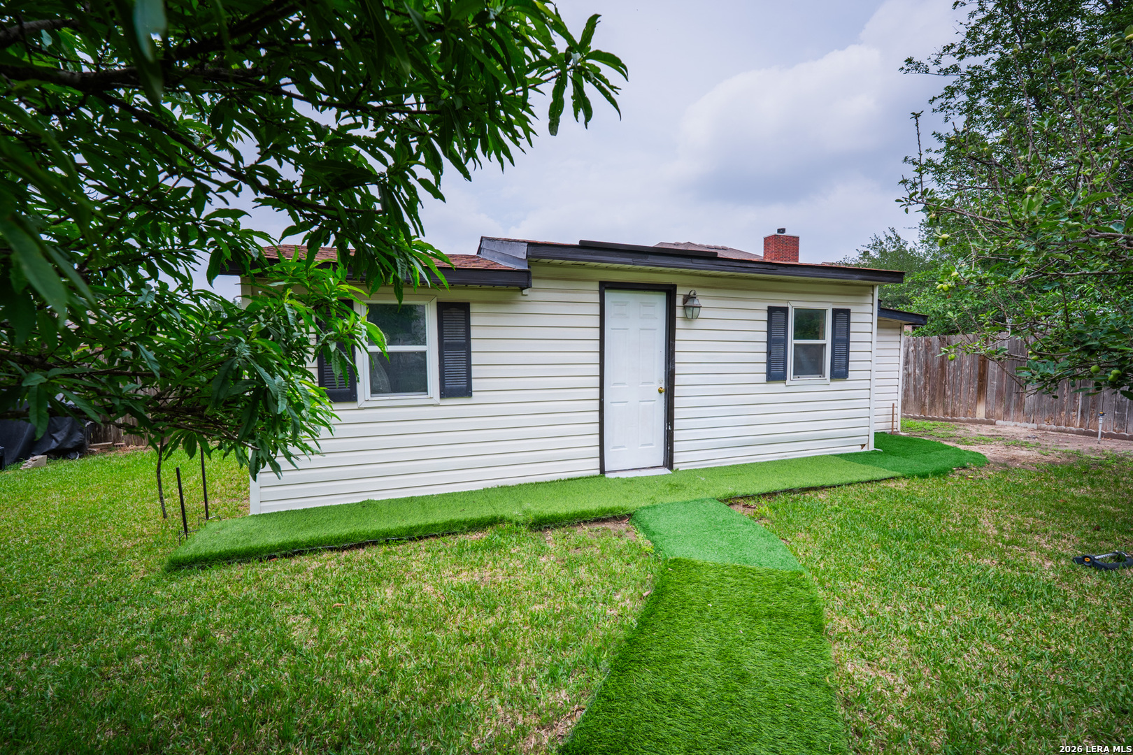 124 Springtree Grove Cibolo, TX 78108 - Photo 45 of 52 a front view of a house with a yard and trees