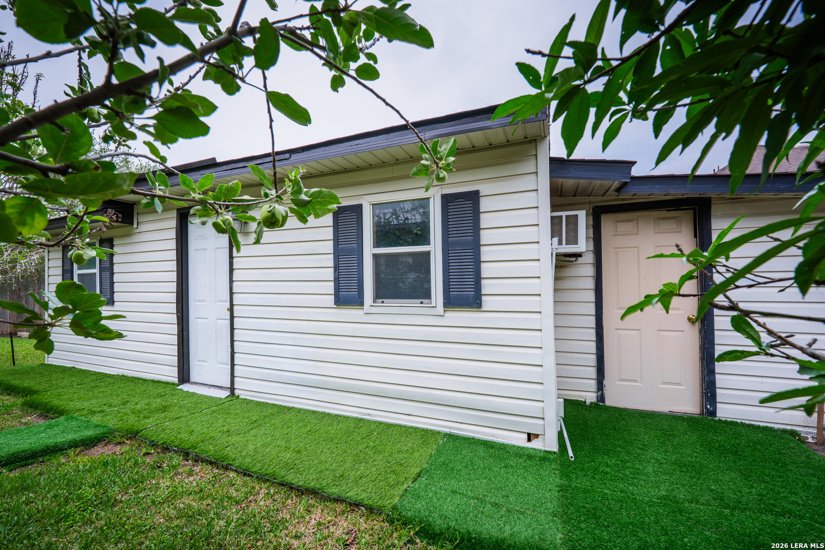 124 Springtree Grove Cibolo, TX 78108 - Photo 46 of 52 a view of a house with a yard and a large tree