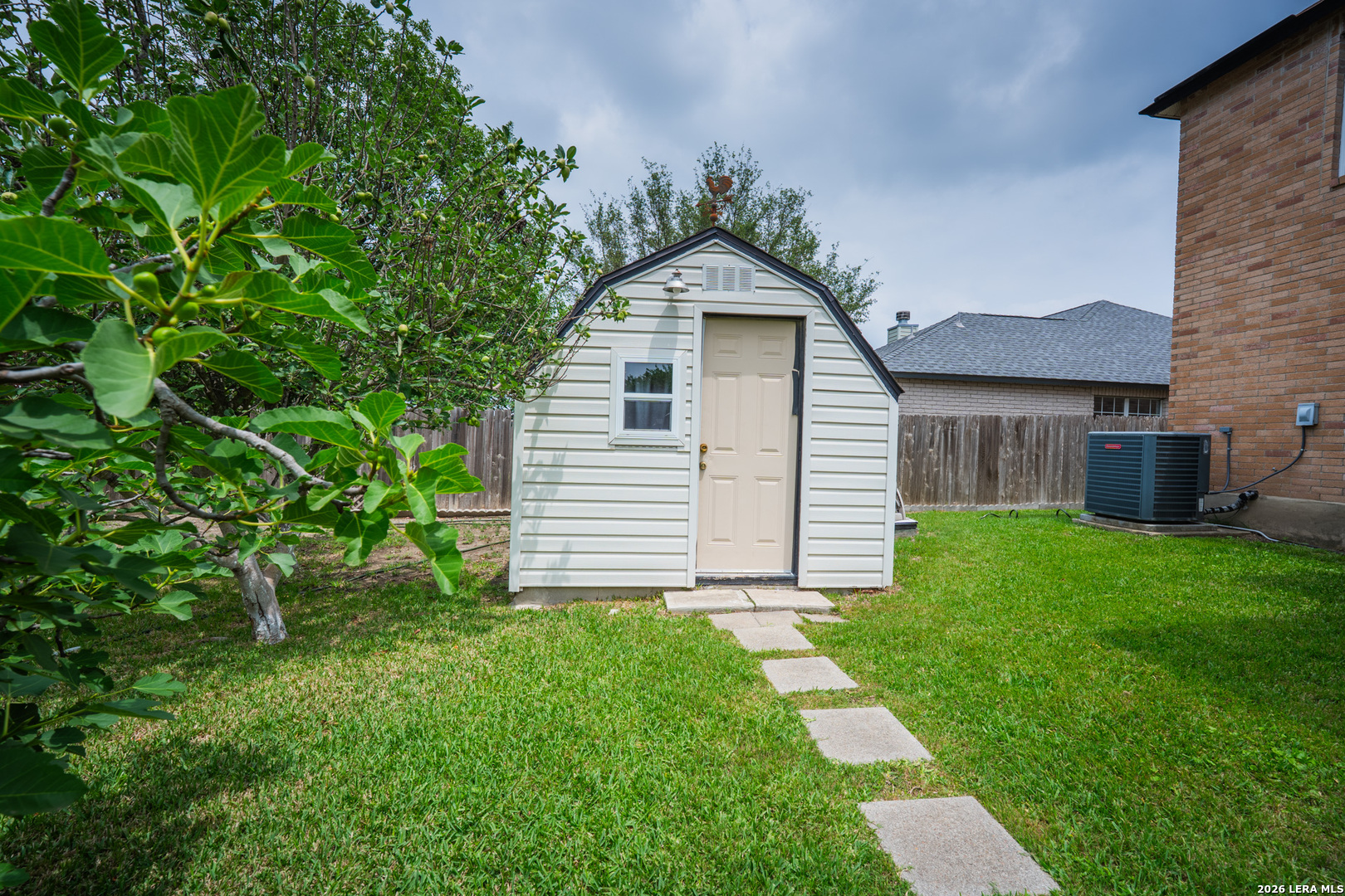 124 Springtree Grove Cibolo, TX 78108 - Photo 49 of 52 a view of a house with a yard