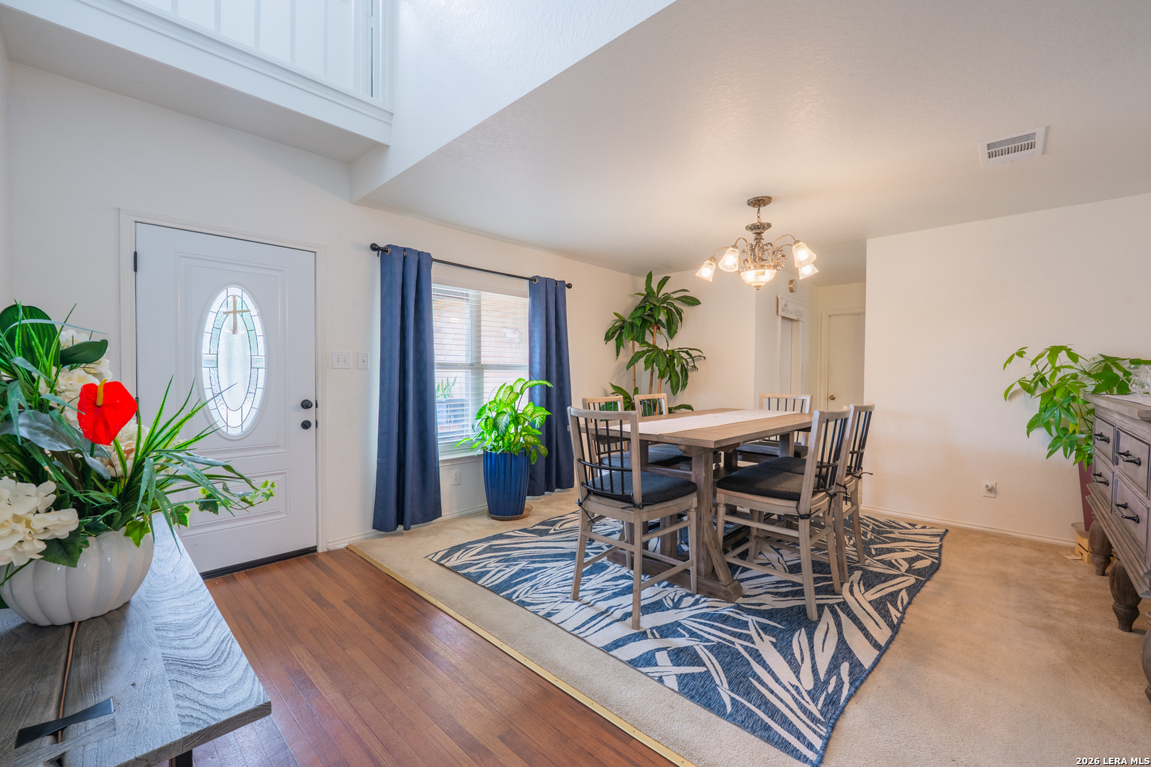 124 Springtree Grove Cibolo, TX 78108 - Photo 5 of 52 a view of a dining room with furniture and a potted plant