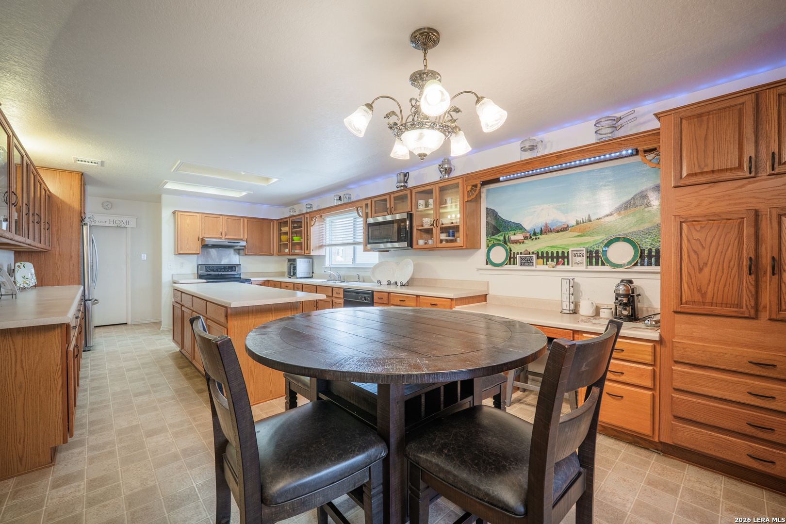 124 Springtree Grove Cibolo, TX 78108 - Photo 6 of 52 a view of a dining room with furniture and wooden floor