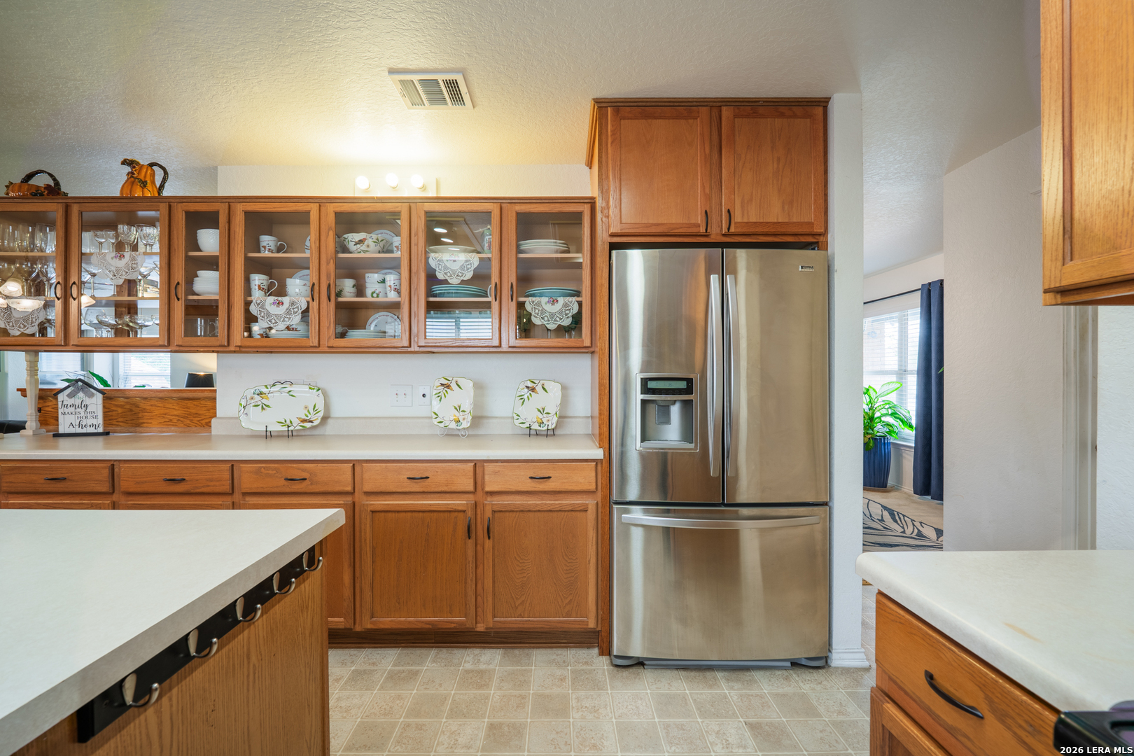 124 Springtree Grove Cibolo, TX 78108 - Photo 9 of 52 a kitchen with stainless steel appliances granite countertop a refrigerator and a sink
