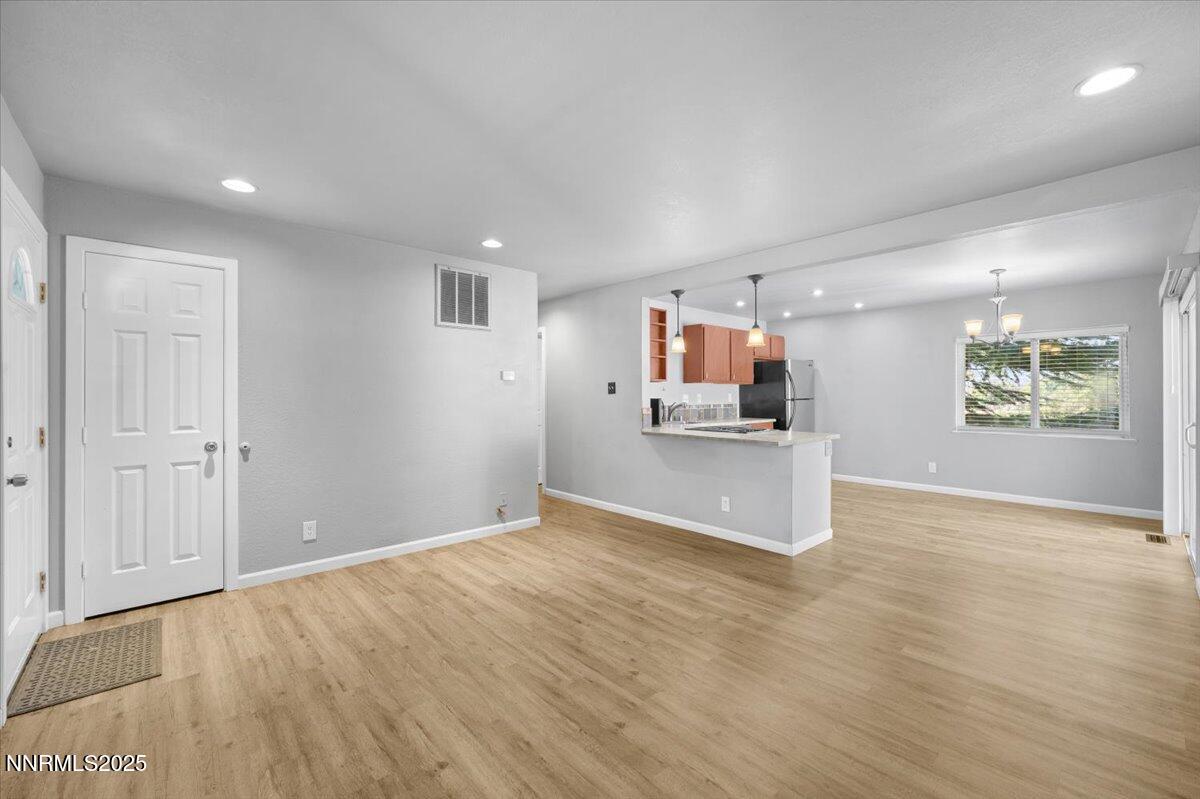 3080 Slater Avenue Reno, NV 89503 - Photo 3 of 17 a view of kitchen and hall with wooden floor and a kitchen