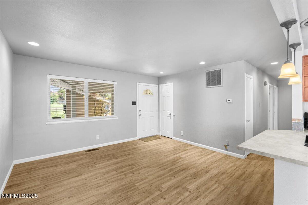 3080 Slater Avenue Reno, NV 89503 - Photo 4 of 17 a view of a big room with wooden floor and windows