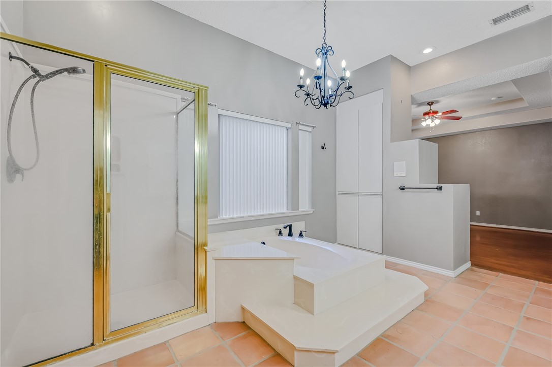 5917 Harvest Hill Road Corpus Christi, TX 78414 - Photo 25 of 40 a spacious bathroom with a tub sink and a mirror