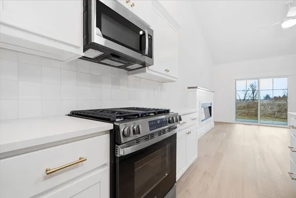 a kitchen with a sink and cabinets