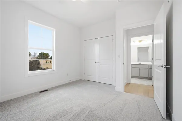 a bathroom with a sink toilet a mirror and shower