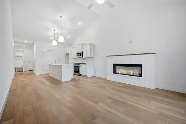 wooden floor in an empty room with a fireplace