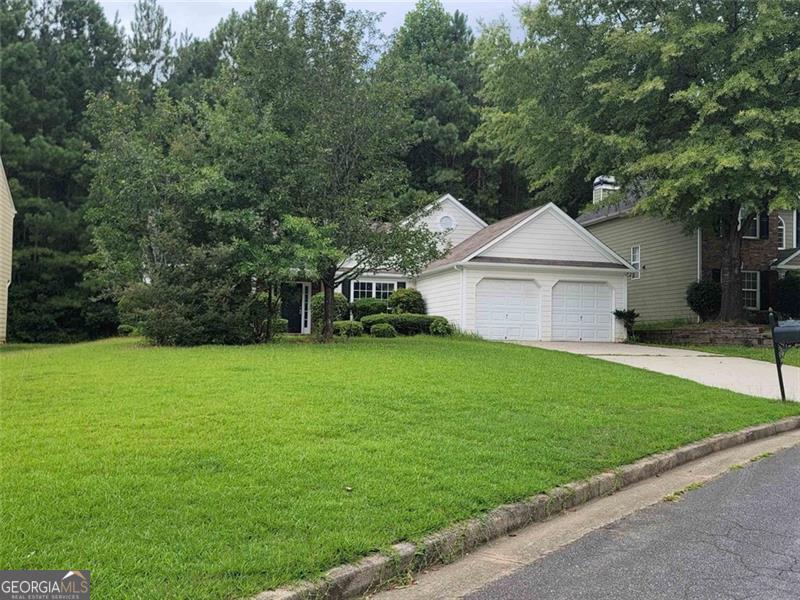3014 Stirrup Lane Southwest Marietta, GA 30064 - Photo 2 of 10 a front view of a house with garden