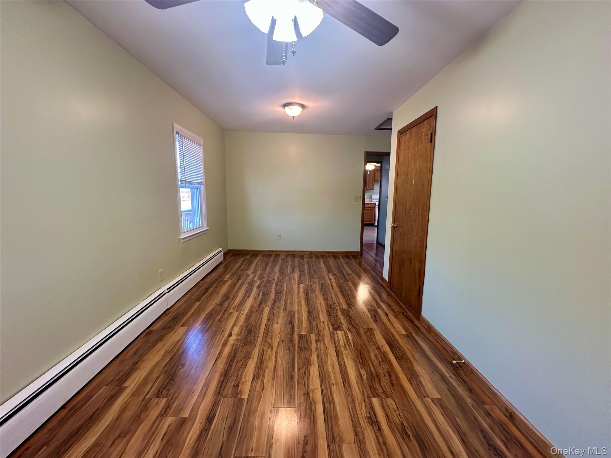 111 Round Hill Road Florida, NY 10921 - Photo 11 of 14 wooden floor in an empty room with a window
