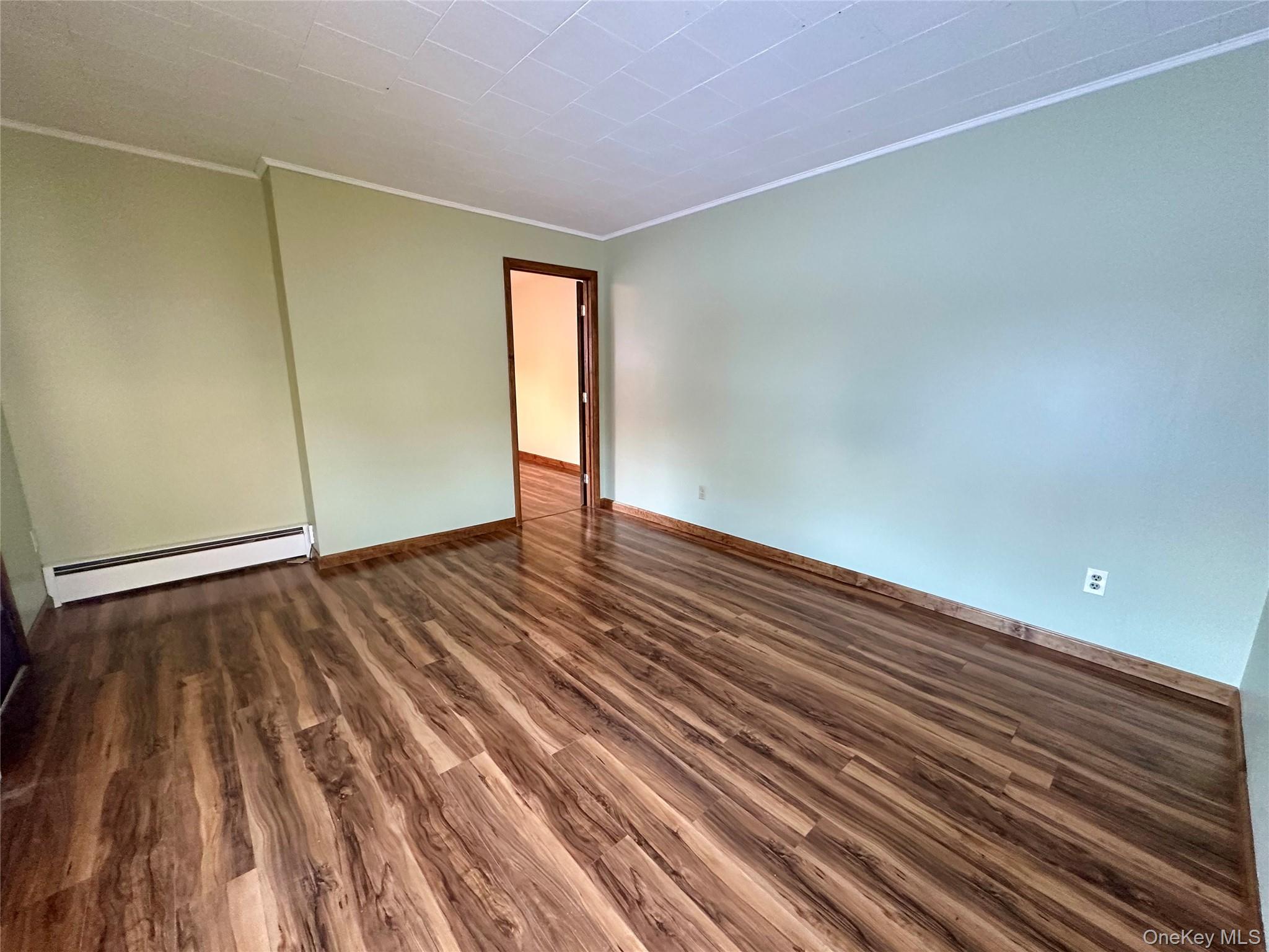 111 Round Hill Road Florida, NY 10921 - Photo 3 of 14 a view of an empty room with wooden floor and a window