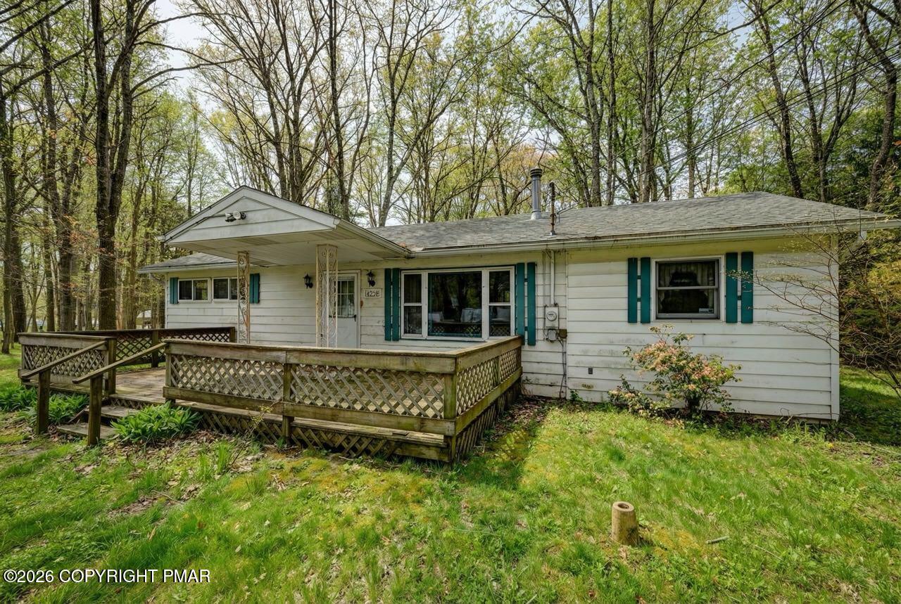 1912 Johns Road Effort, PA 18330 - Photo 1 of 44 a front view of a house with a garden