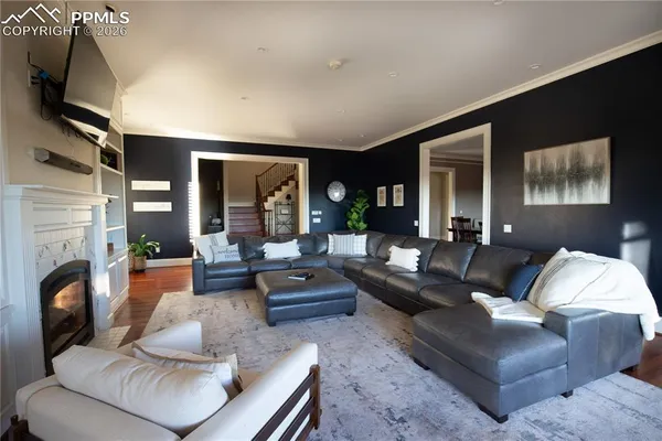 a living room with furniture fireplace and a flat screen tv