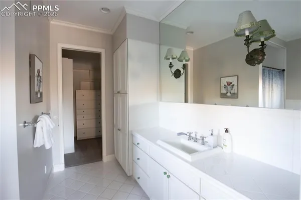 a bathroom with a sink and mirror