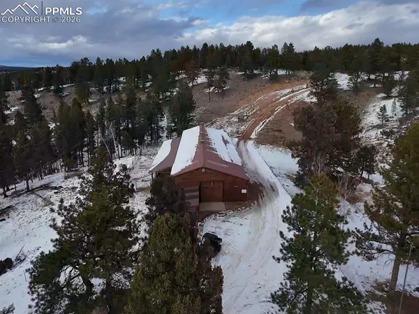 a view of a town with mountains in the background