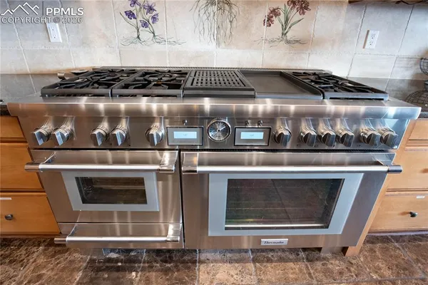 a close view of a stove in the kitchen