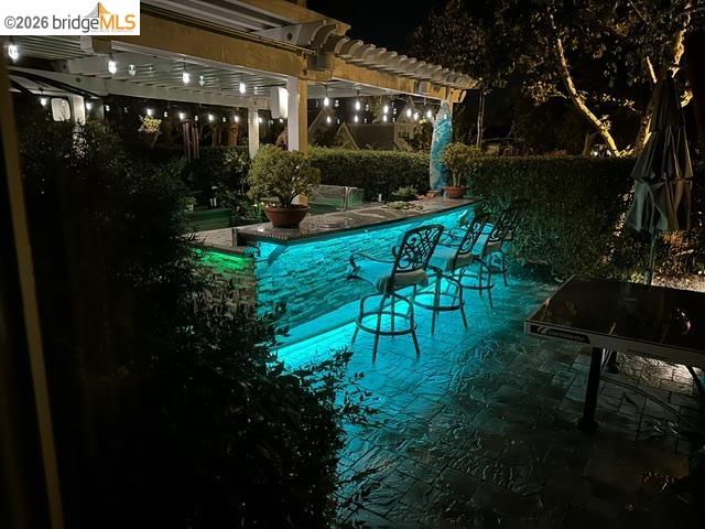 550 Rutherford Circle Brentwood, CA 94513 - Photo 23 of 28 Pool at night with a pergola, a patio area, and an outdoor pool
