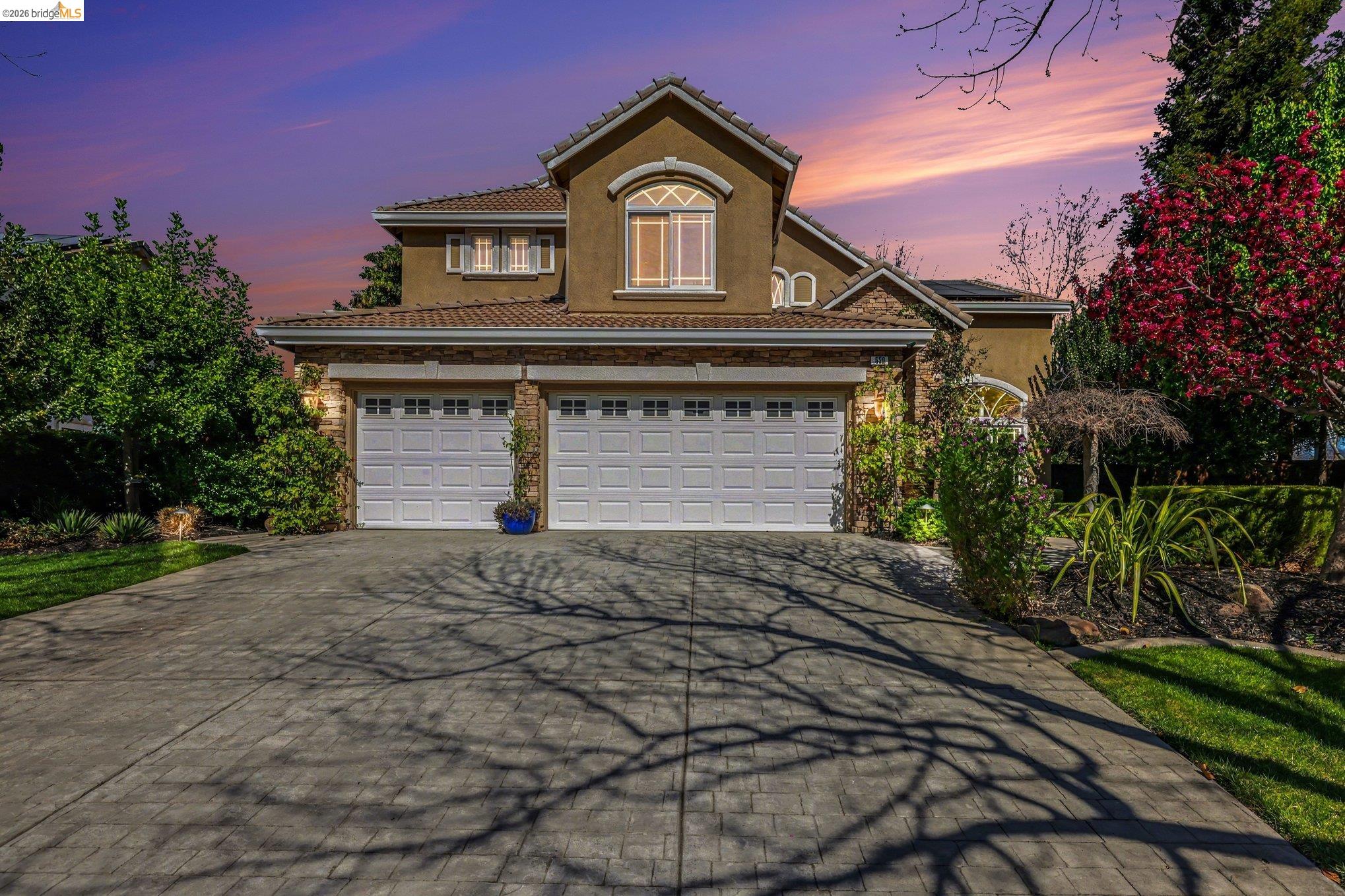 550 Rutherford Circle Brentwood, CA 94513 - Photo 3 of 28 Traditional-style house with stucco siding, driveway, and a tiled roof