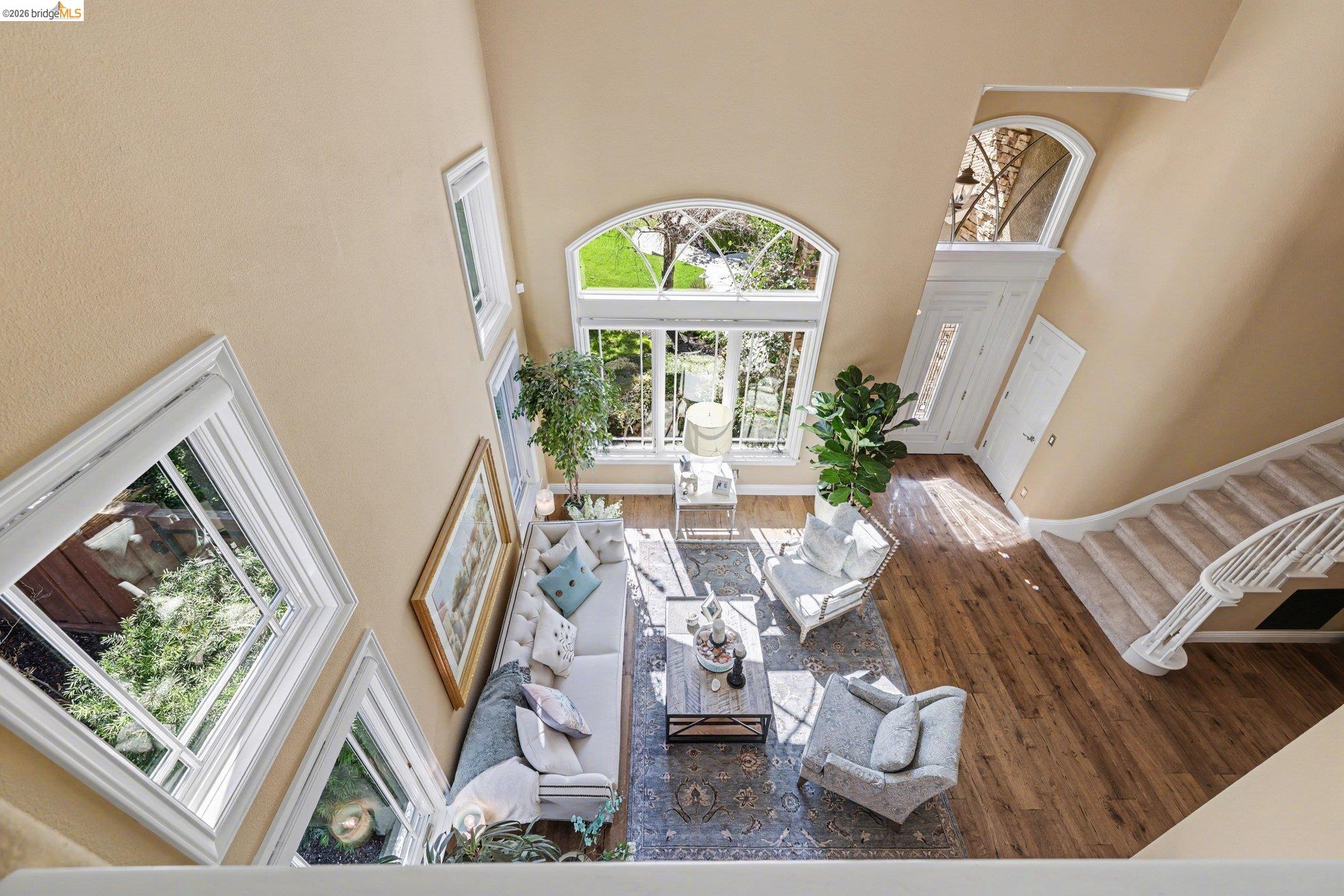 550 Rutherford Circle Brentwood, CA 94513 - Photo 6 of 28 Living area with a high ceiling and dark wood-style floors