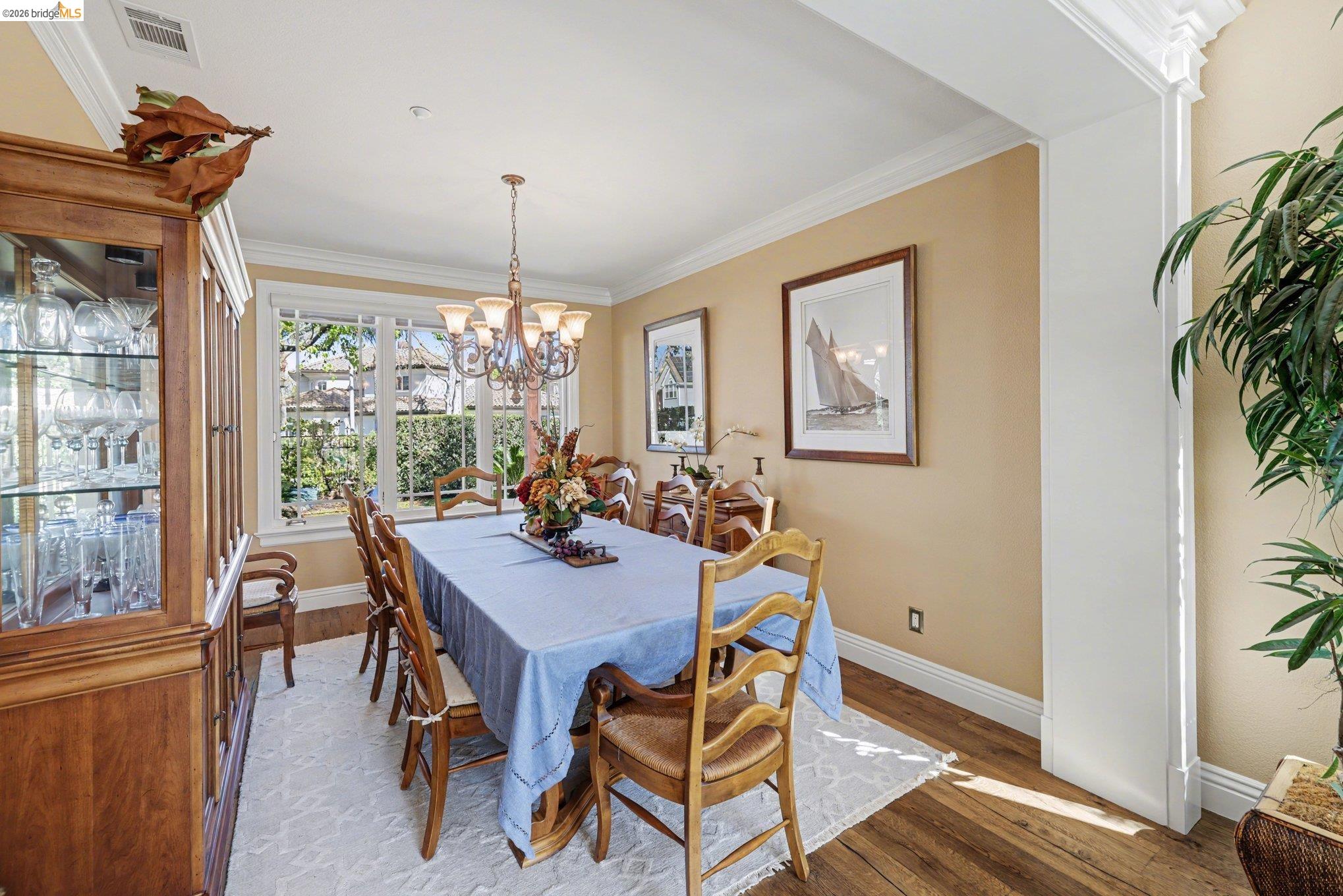 550 Rutherford Circle Brentwood, CA 94513 - Photo 7 of 28 Dining area featuring ornamental molding, wood finished floors, and suspended lighting