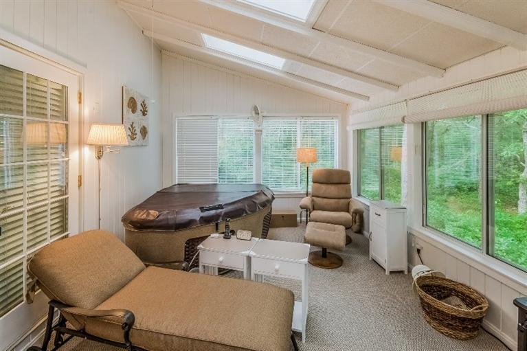 17 Meadowbrook Road Mashpee, MA 02649 - Photo 12 of 29 a living room with furniture and a floor to ceiling window
