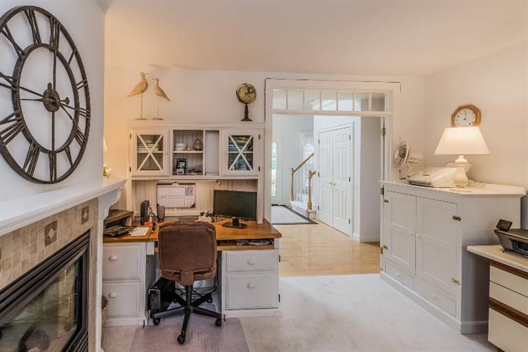 17 Meadowbrook Road Mashpee, MA 02649 - Photo 17 of 29 a view of a workspace with furniture and a fireplace