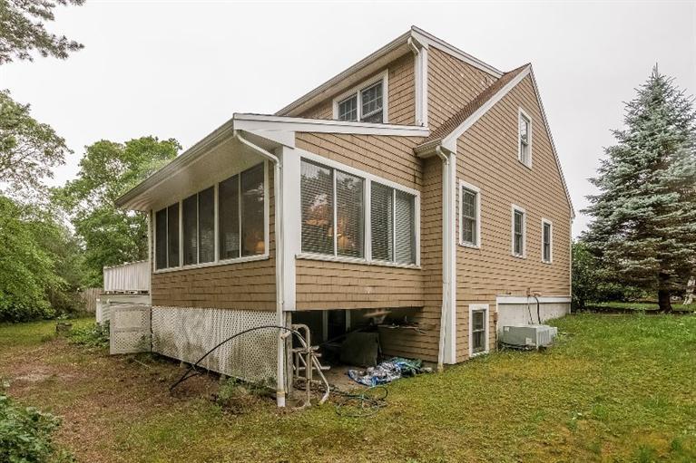 17 Meadowbrook Road Mashpee, MA 02649 - Photo 26 of 29 a front view of a house with a yard