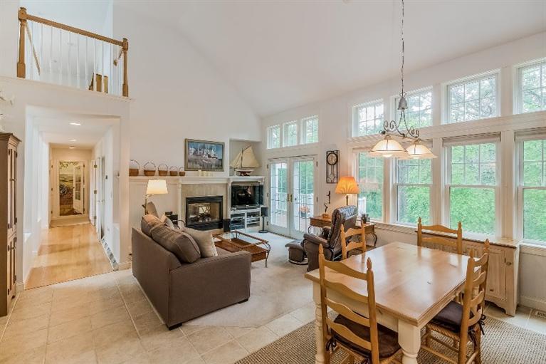 17 Meadowbrook Road Mashpee, MA 02649 - Photo 5 of 29 a living room with fireplace furniture and a chandelier