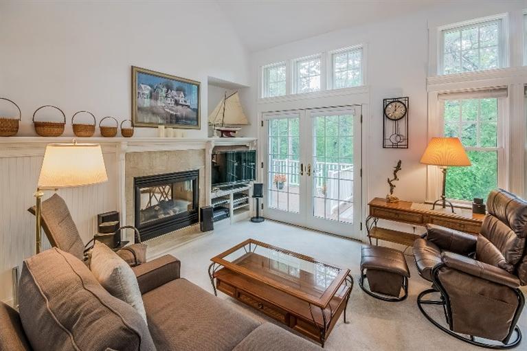 17 Meadowbrook Road Mashpee, MA 02649 - Photo 6 of 29 a living room with furniture and a fireplace