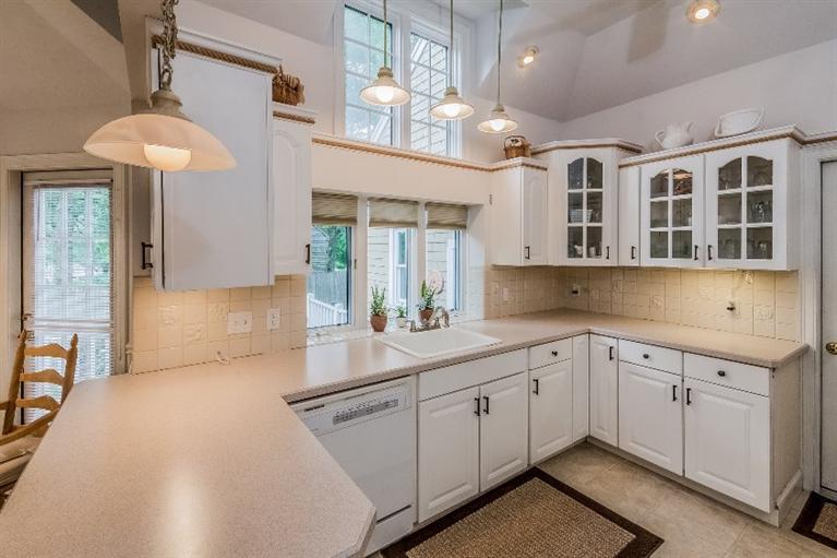 17 Meadowbrook Road Mashpee, MA 02649 - Photo 7 of 29 a kitchen with a sink cabinets and window