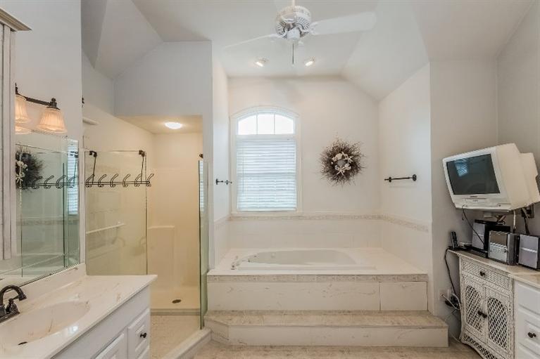 17 Meadowbrook Road Mashpee, MA 02649 - Photo 10 of 29 a bathroom with a bathtub shower sink and mirror