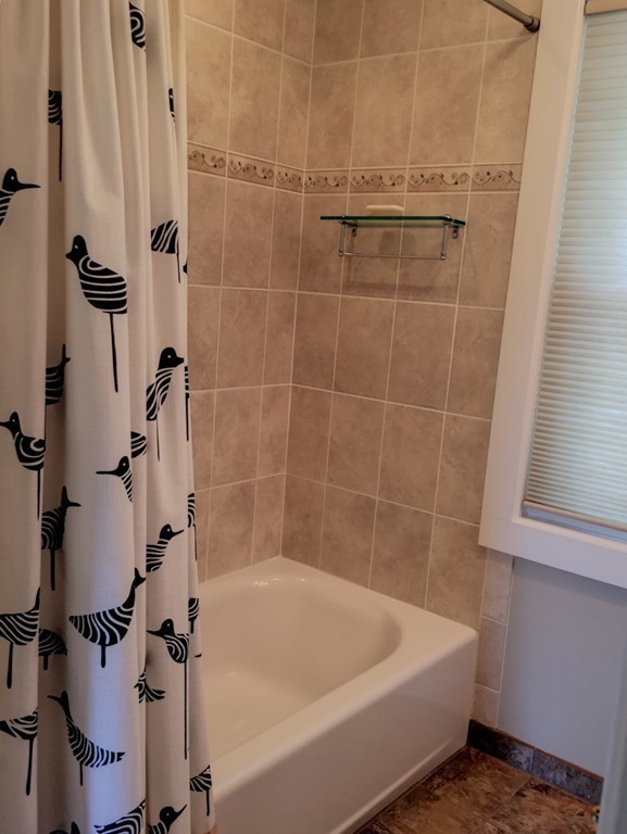 62 Edgehill Road Winthrop, MA 02152 - Photo 13 of 29 a bath tub sitting next to a white sink