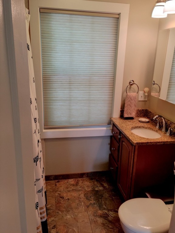 62 Edgehill Road Winthrop, MA 02152 - Photo 14 of 29 a bathroom with a sink a toilet and shower