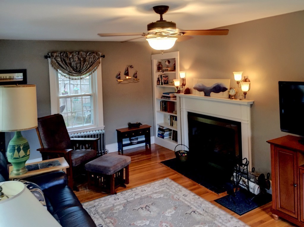 62 Edgehill Road Winthrop, MA 02152 - Photo 2 of 29 a living room with furniture and a fireplace