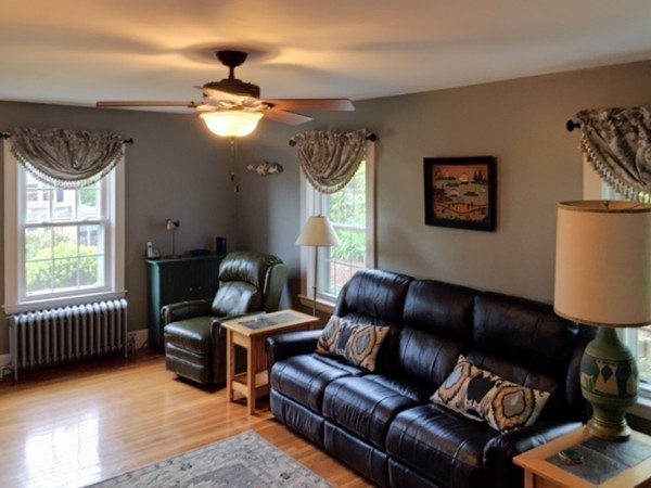 62 Edgehill Road Winthrop, MA 02152 - Photo 4 of 29 a living room with furniture a window and a chandelier